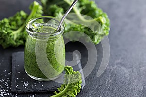 Delocious kale pesto sauce and fresh raw leaves