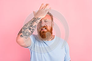 Delusion man with beard and light blue t-shirt photo