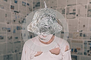 Delusional paranoid man with tin foil hat talking