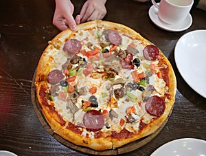 Deluxe Pizza with Pepperoni, Sausage, Mushrooms and Peppers