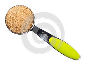 Demerara brown sugar in measuring spoon cutout