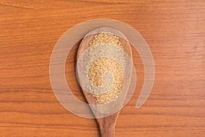 Demerara Sugar into a spoon