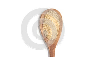 Demerara Sugar into a spoon