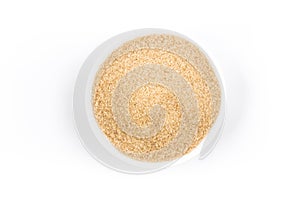 Demerara sugar in a white bowl. Top view