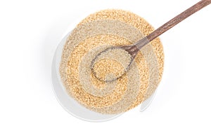 Demerara sugar in a white bowl. Top view