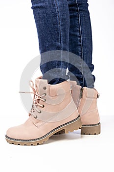 Demi-season, women`s shoes, pink, on the feet in jeans, white background, laces