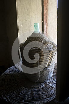 Demijohn covered with wicker