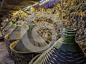 Demijohn in a wine cellar in the Italian countryside