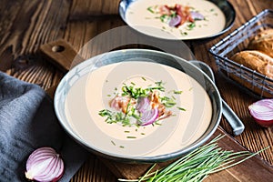 Demikat, classic Slovakian creamy sheep cheese soup topped with roasted bacon and fresh chives