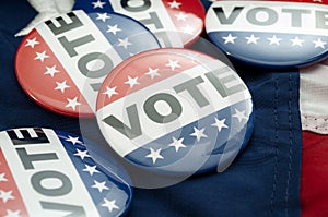 Democrat vs republican poll, democratic decision and primary voting conceptual idea with Vote election campaign button badges and photo