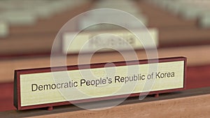 Democratic People`s Republic of Korea DPRK name sign among different countries plaques at international organization