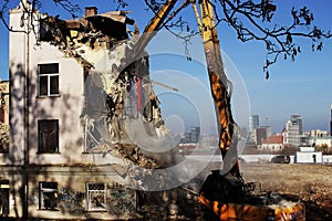 Bulldozer demolishes old soviet union building remains in Vilnius