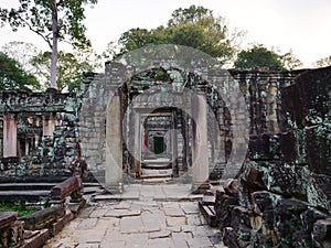 Demolished stone rock door frame at Preah Khan temple Angkor Wat complex, Siem Reap Cambodia. A popular tourist attraction nestled