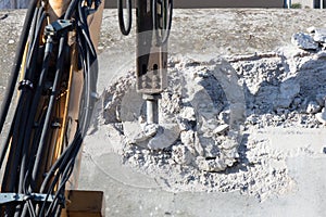 Demolishing hard concrete structure with the breaker