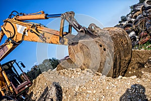 Demolishing operations at industrial construction site. worker using bulldozer wrecking