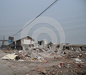 Demolishing site with ruined buildings and heaps of debris