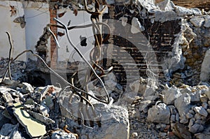 Demolition of an apartment building. reinforcing concrete with wires looks out of the masonry and creates an apocalyptic scene. cl