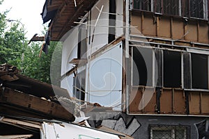 Demolition of a building in deconstruction site with debris, remains and ruined walls