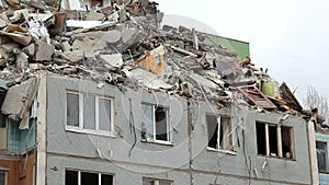 Demolition of building in urban environments with heavy machinery