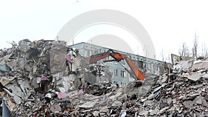 Demolition of building in urban environments with heavy machinery