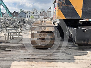 Demolition of buildings. Construction machinery at the construction site is engaged in the dismantling of buildings