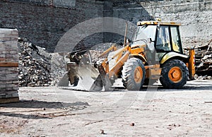 Demolition bulldozer at urban renewal construction site