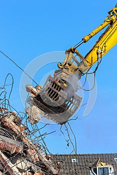 Demolition crane dismantling a building