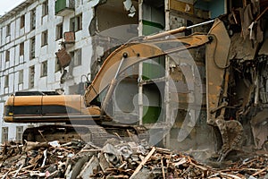 Demolition of a five-story apartment building recognized as emergency housing, close-up of an excavator bucket collects