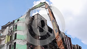 Demolition of a high-rise building. The collapse of a residential building. Construction work on the demolition of multi