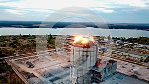 Demolition of old industrial building by exploding dynamite, aerial view
