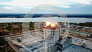 Demolition of old industrial building by exploding dynamite, aerial view