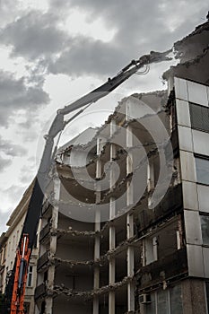 Demolition Pulveriser Demoliting Building in the City