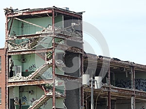 Demolition site of building with exposed walls, interiors