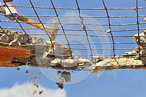 Demolition with sledge hammer