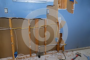 Demolition walls from gypsum plasterboard drywall with material for repairs in an kitchen is under construction remodeling