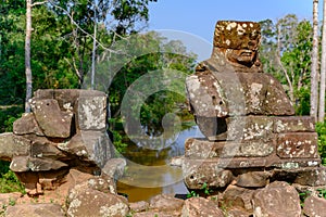 Demon fallen apart on Temple of Angkor Thom, Cambodia.