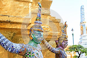 Demon or giant carring golden pagoda at Wat Phra Kaew or the Temple of the Emerald Buddha