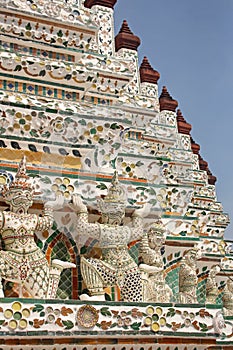 Demon Guardian statues in stupa of Wat Arun temple, in Bangkok Thailand.