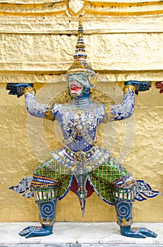 The demon statue supporting golden pagoda