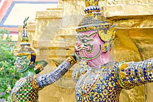 The demon statue supporting golden pagoda