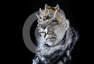 Demonic creature with thorns on head isolated on black background. King of realm of perpetual cold. Man with fictional