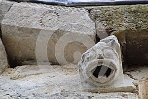 Demonic relief in Romanesque church facade