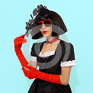 Demonic vampire gothic Lady in red gloves holding black roses. Role-playing games, halloween, party shop trendy accessories