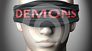 Demons can make things harder to see or makes us blind to the reality - pictured as word Demons on a blindfold to symbolize denial