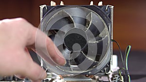 Demonstration of dust pollution. Dirty cooler and CPU heatsink from dust.