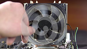 Demonstration of dust pollution. Dirty cooler and CPU heatsink from dust.