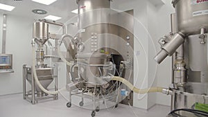 The demonstration of industrial equipment and metal facilities in production hall of pharmaceutical plant. the automated