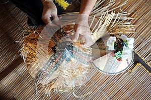 Weaving of sirung Papar photo