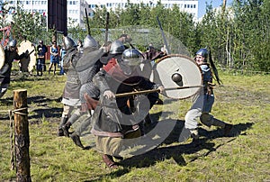 Demonstration performances of fighters fencing swords, axes and shields. Festival of historical reconstruction clubs Slavic mill