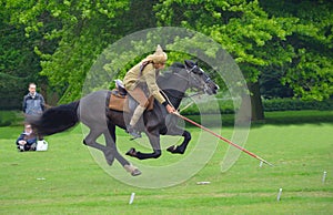 Demonstration of the sport of Tent Pegging at full gallop by a member of the Punjab Lancers in World War One uniform